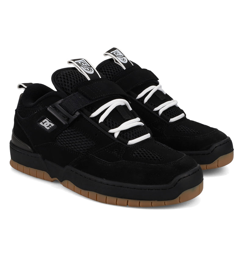 Black sneakers with white laces on a white background