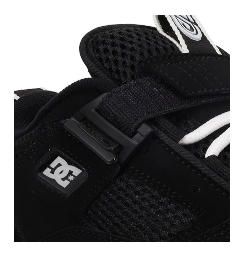 Close-up of a black glove with a buckle and DC logo on a white background
