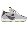 The Men's JS 2 Shoes by DC Shoes feature a gray and black colorway with white laces, a white midsole, neon green details, and a textured green outsole—iconic John Shanahan collection style shown in side profile.