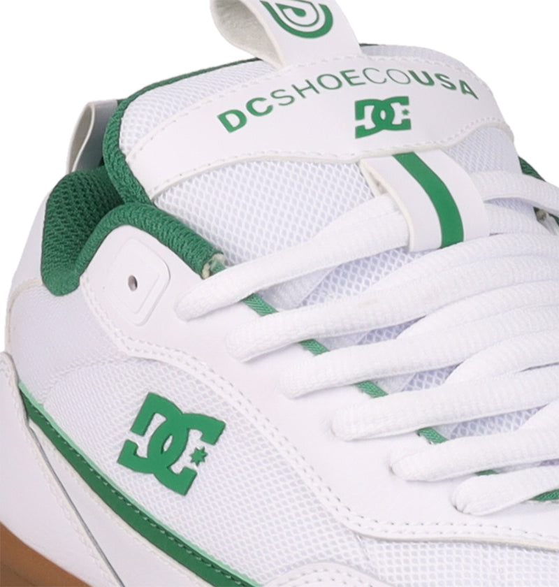 Close-up of the white and green DC Shoes Men's JS-2 Shanahan Pro Skate Shoe, featuring mesh and leather details, John Shanahan’s pro model logo on the side, and DCSHOECOUSA text on the tongue tab.