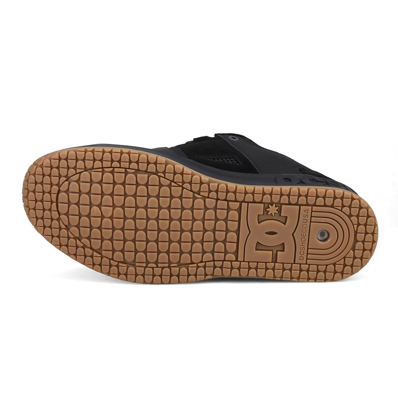 The image shows the sole of the Men's Lynx OG Shoes by DC Shoes, a DC Team skateboarding favorite, featuring a textured gum tread and the embossed DC Shoes logo near the heel—a tribute to classic Lynx design.