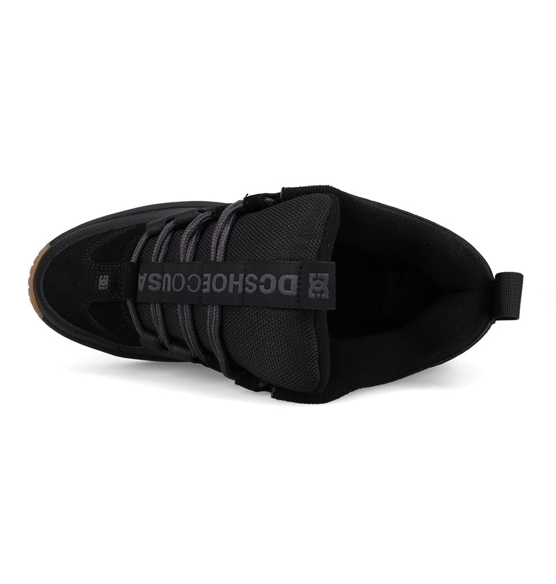 Top view of the Men's Lynx OG Shoes by DC Shoes, a skateboarding favorite with black laces, a black tongue with gray DCSHOECOUSA lettering, heel pull tab, and brown rubber sole at the toe.