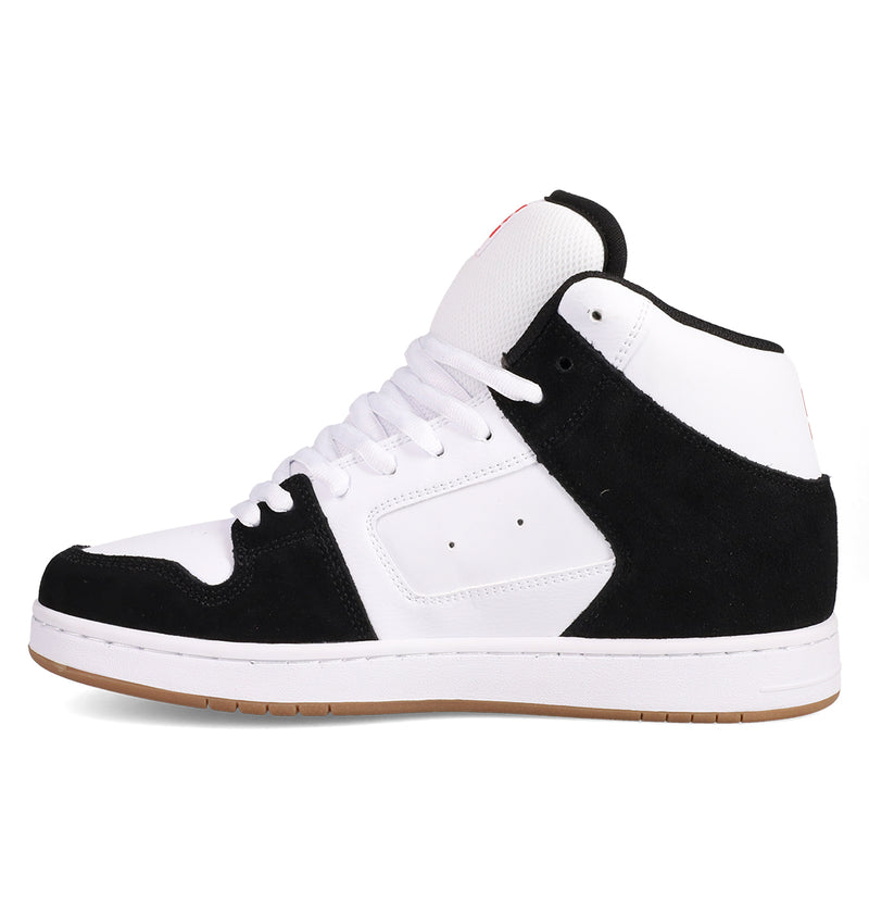 The DC Shoes Men's Manteca 4 Hi features a vintage high-top design with a white upper, black suede overlays, white laces and midsole, plus a light brown rubber outsole, shown in side profile.