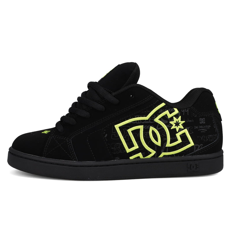 The Men's Net Shoes by DC Shoes feature a black low-top design, bold DC branding, neon yellow side logo, black laces, and subtle graphics. Crafted from durable fabrics, these puffy sneakers offer lasting style and comfort.