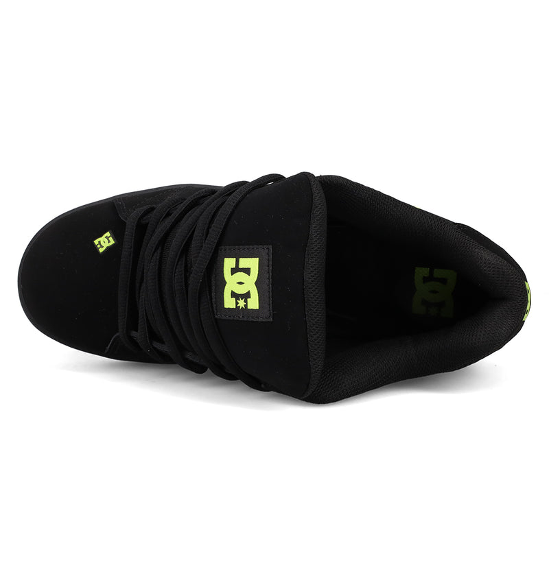 Top view of DC Shoes Men's Net Shoes, a puffy skate sneaker featuring black laces, durable fabric, and yellow-green DC branding on the tongue and inner heel.
