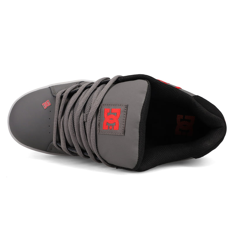 Top view of the Men's Net Shoes by DC Shoes with gray durable fabric, black lining, red DC logo on the tongue, and thick gray laces.
