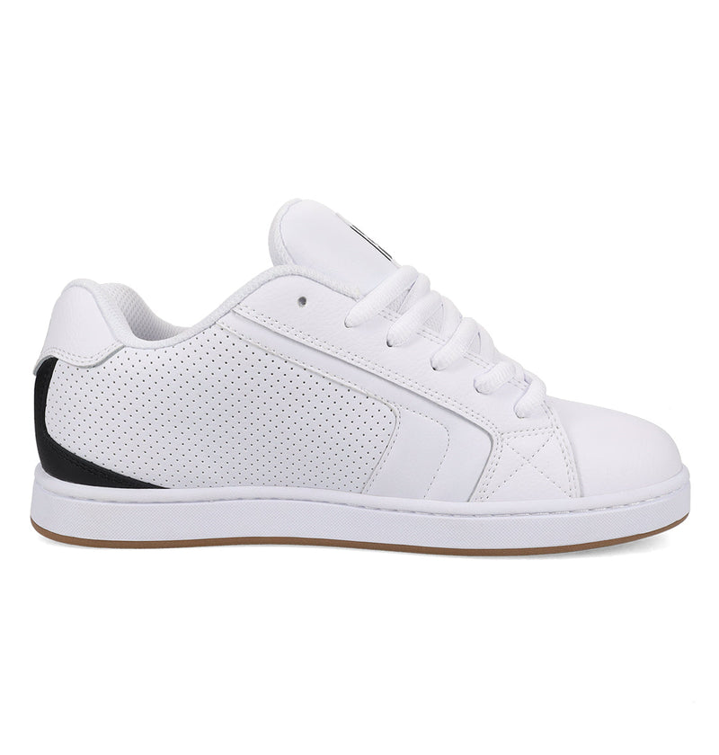 The DC Shoes Men's Net Shoes are white low-top sneakers with white laces, a perforated side panel, subtle stitching, a black heel accent, and a durable light brown sole for all-day comfort. Shown from the side on a plain background.