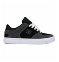 The Men's Onyx S Shoes by DC Shoes feature a minimal black and grey vulc design with white laces, a white sole, and an Onyx DC logo on the side, displayed against a plain white background.