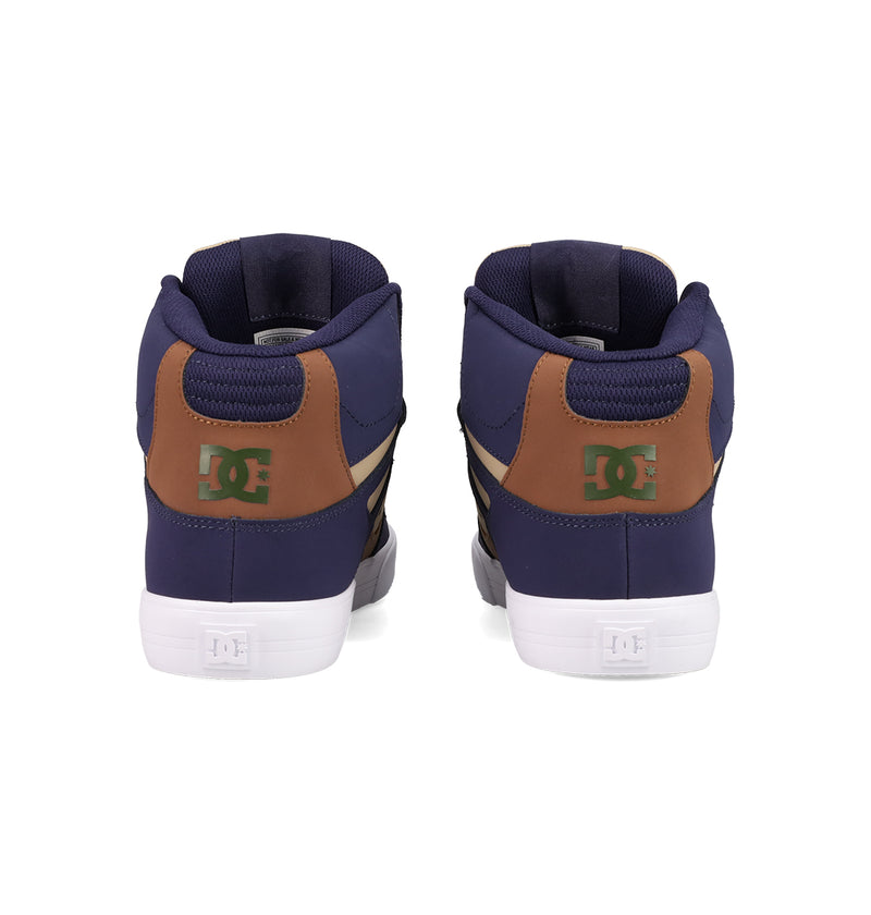 A pair of DC Shoes Men's Pure High Top WC skate shoes in navy and brown, with green DC logos on the heels, a vulcanized outsole, and white soles, viewed from the back against a white background.
