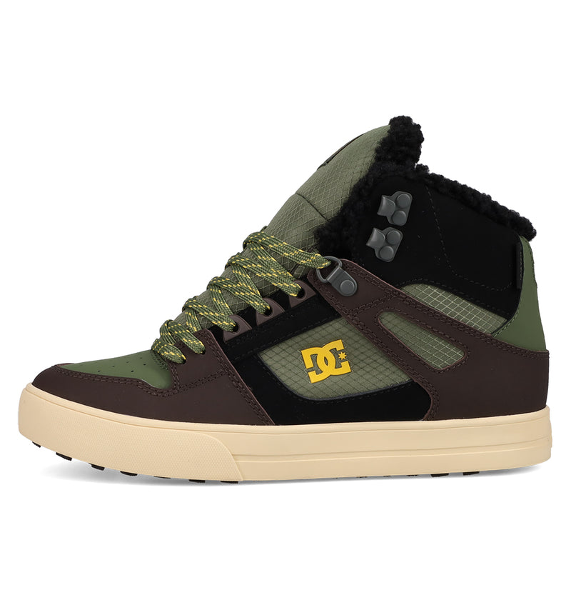 The Men's Pure High Top WC Shoes by DC Shoes feature green, brown, and black panels, yellow logo, green/yellow laces, a black padded collar, and beige sole. These high-tops offer rugged style with a vintage outdoor-inspired design.