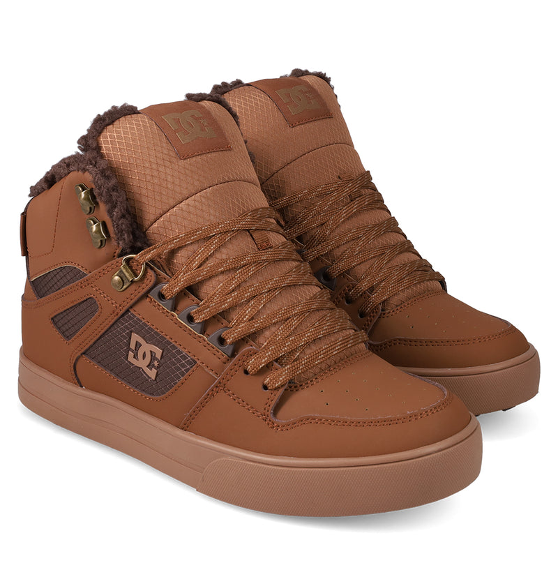 Men's Pure High Top WC Shoes by DC Shoes feature a brown high-top design, textured laces, quilted tongues, faux fur collar lining, gold eyelets, a vulcanized outsole, and a signature DC logo on the side.