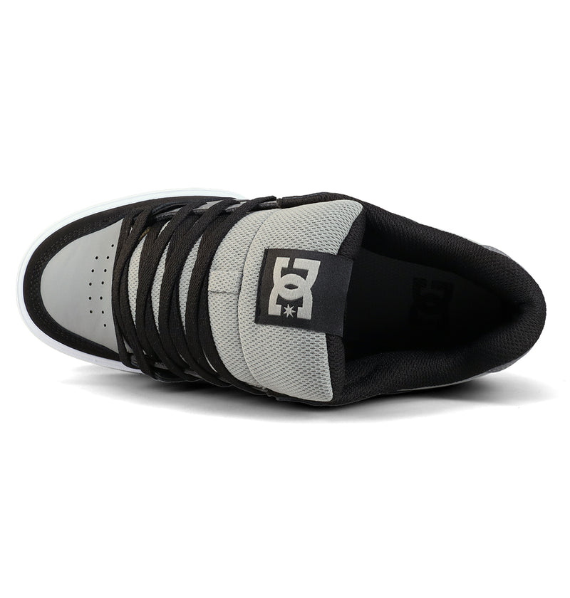A top view of the DC Shoes Men's Pure Shoes in gray and black with black laces and logo on the tongue, shown against a white background—ideal for anyone wanting versatile style and comfort.