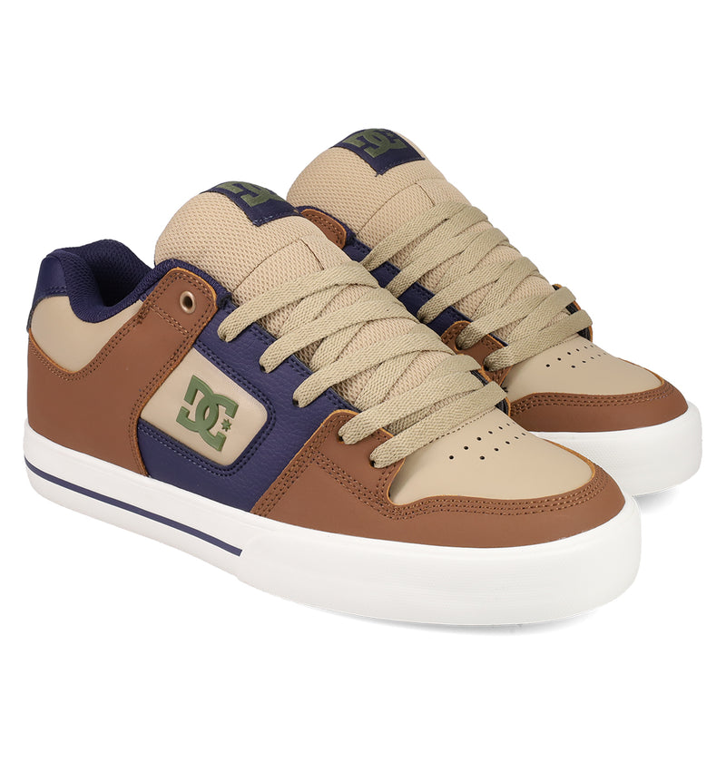 The DC Shoes Men's Pure Shoes feature tan, brown, and dark blue panels, beige laces, white soles, and the DC logo on the side and tongue for stylish comfort.