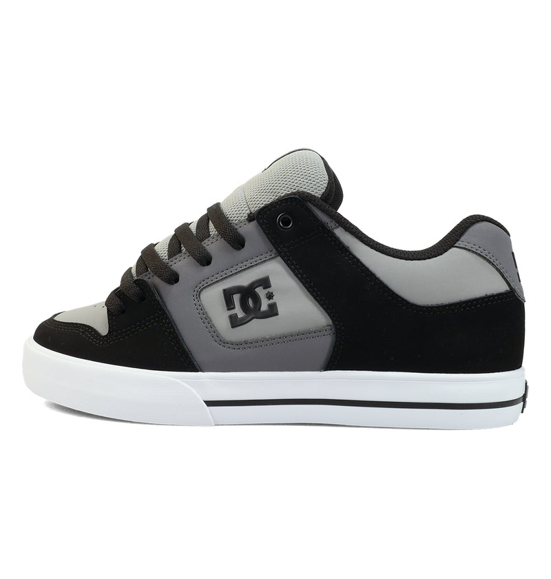 The DC Shoes Men's Pure Shoes in black and gray feature white accents, the DC logo on the side, black laces, and a white rubber sole with a black stripe. Seen from the side against a white background.