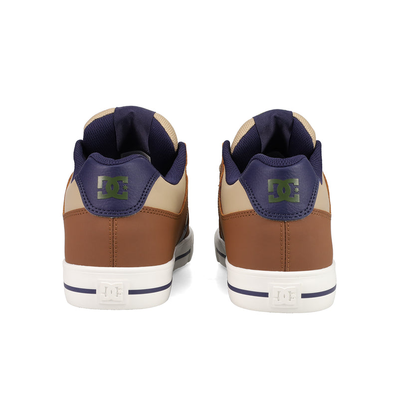 A pair of DC Shoes Men's Pure Shoes in brown and beige, seen from the back, with navy accents, green DC logos on the heel, and white soles—stylish and versatile for everyday wear.