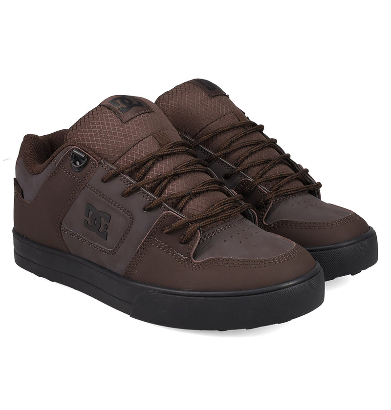A pair of DC Shoes Men's Pure Shoes in brown with black soles, brown laces, and a textured tongue are displayed side by side on a white background—ideal for style and comfort.