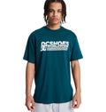 A young person with braided hair wears a teal Reebok Queltra Lhss t-shirt and stands facing forward against a plain white background.