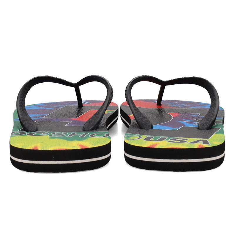 The DC Shoes Men's Spray Graffik Slides are colorful slip-on flip-flops with black straps, bold multicolored soles displaying visible text, and black-and-white striped edges—shown from the back.