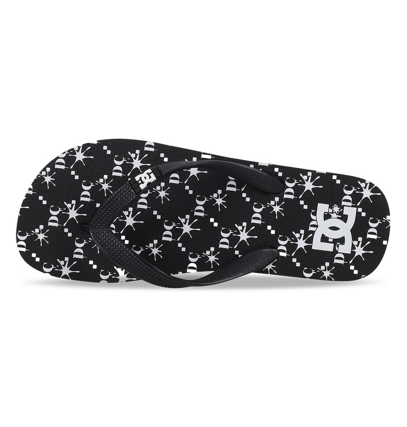 The Men's Spray Graffik Slides by DC Shoes feature black slip-on design with white geometric snowflake-like patterns and a white DC Shoes logo on the heel. The textured black rubber straps make these slides ideal for your next skate session.