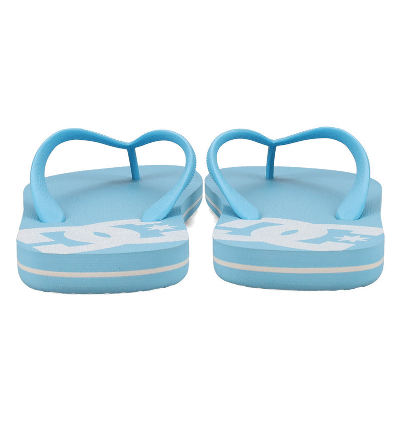 A pair of Men's Spray Slides by DC Shoes in light blue, shown from the back, featuring white branding on the footbeds and white-edged soles—ideal for post-skate session comfort.