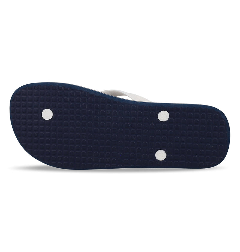 The image shows the bottom view of DC Shoes Men's Spray Slides in navy blue, featuring a textured sole and three visible round white plug attachments.