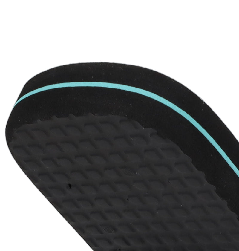 Close-up of the sole of DC Shoes Men's Spray Slides, a black slip-on with a textured surface and thin turquoise edge stripe. The white background highlights these must-have slides, perfect for post-skate relaxation.