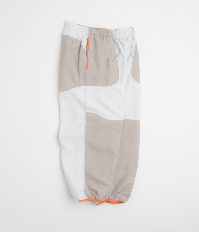 Nike ACG Wolf Tree Plus Pants in Photon Dust and College Grey / Summit White