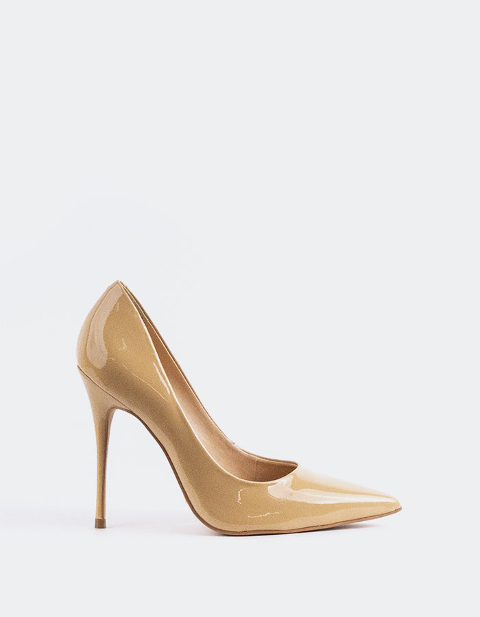 A classic&nbsp; pump is a timeless wardrobe essential.

Versatile enough to pair effortlessly with everything from long, oversized trousers to dresses or skirts, this pump can be dressed up or down with ease. Designed for maximum comfort, it allows you to stay relaxed and confident all day or night, no matter the occasion.

Detail(s):&nbsp;

Pointy Toe
4.25”&nbsp; Straight Stiletto Heel
We recommend sizing up, as this item runs small.

Material(s):&nbsp;

Patent Leather Upper&nbsp;
Padded Leather Insole
Mad