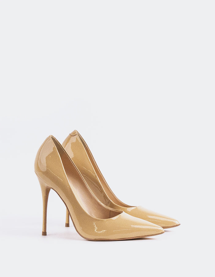 A classic&nbsp; pump is a timeless wardrobe essential.

Versatile enough to pair effortlessly with everything from long, oversized trousers to dresses or skirts, this pump can be dressed up or down with ease. Designed for maximum comfort, it allows you to stay relaxed and confident all day or night, no matter the occasion.

Detail(s):&nbsp;

Pointy Toe
4.25”&nbsp; Straight Stiletto Heel
We recommend sizing up, as this item runs small.

Material(s):&nbsp;

Patent Leather Upper&nbsp;
Padded Leather Insole
Mad