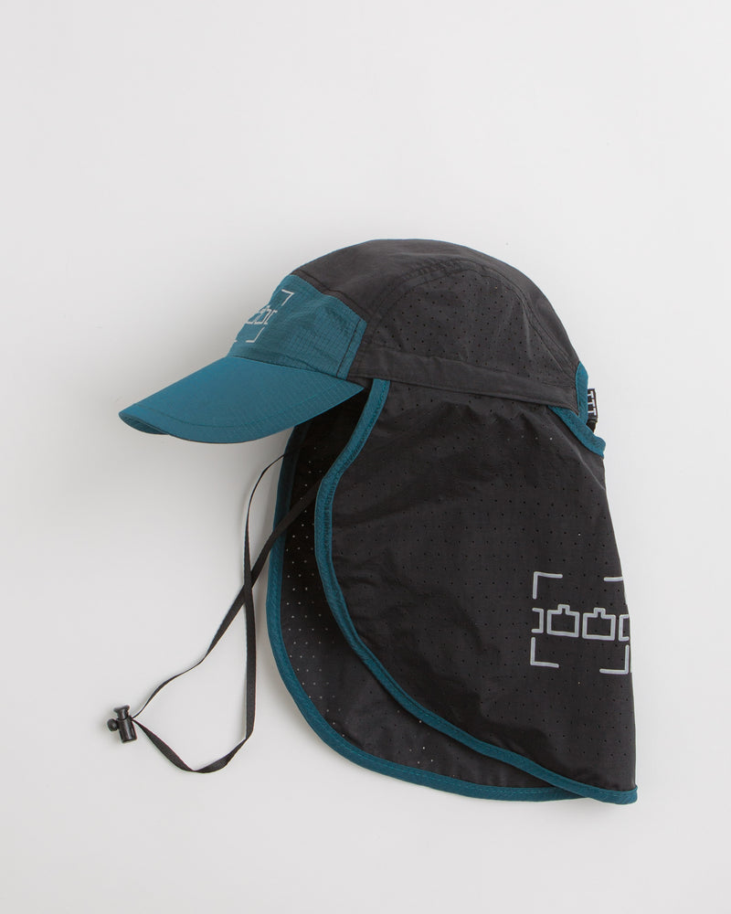 The Trilogy Tapes Neck Cape Trail Cap in Blue and Black