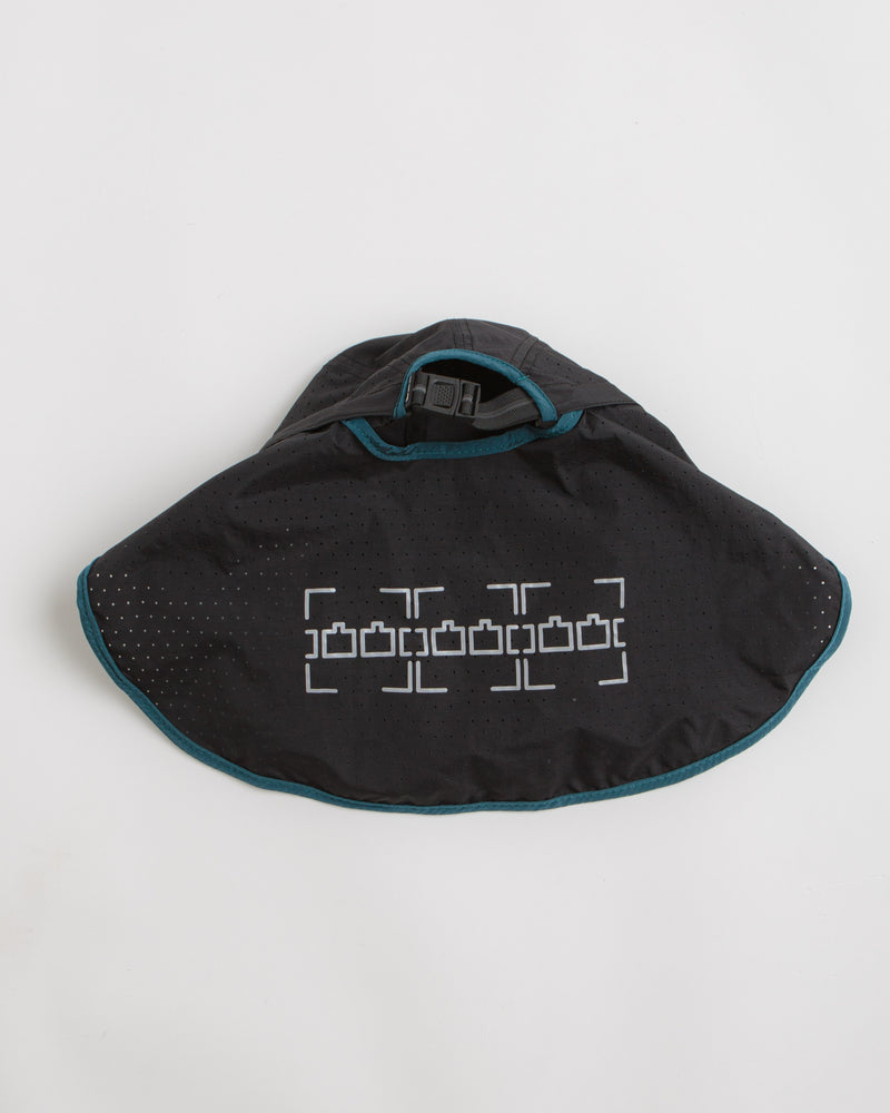The Trilogy Tapes Neck Cape Trail Cap in Blue and Black