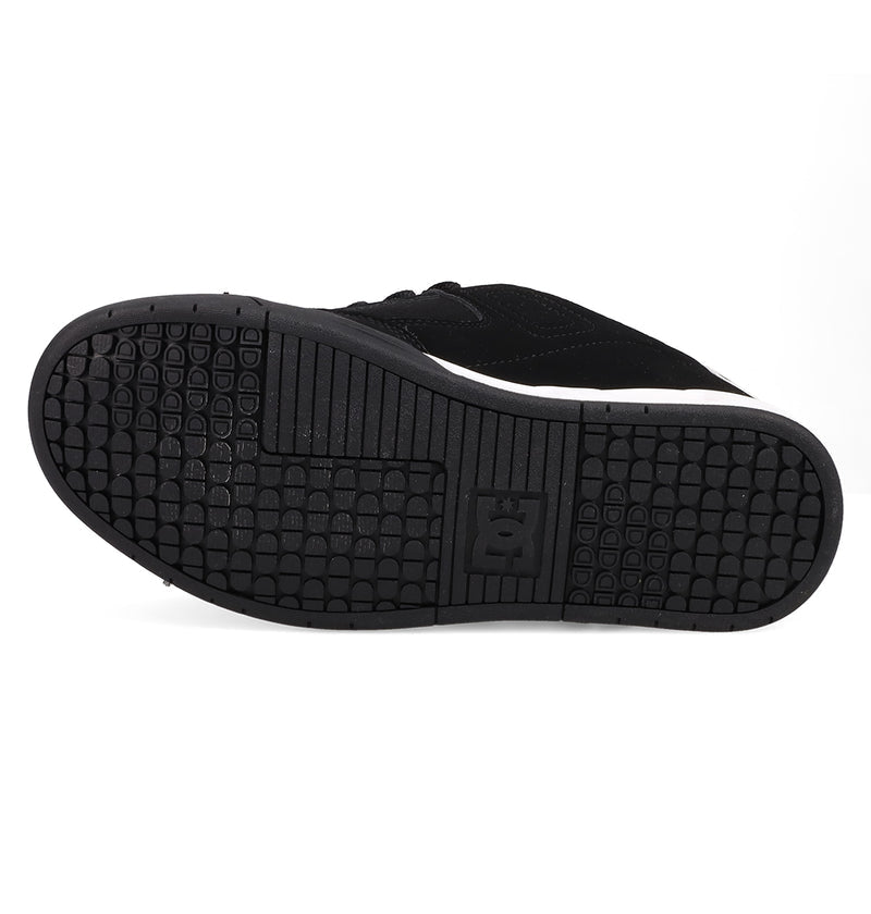 The image shows the black rubber sole of the Women's DC Command Shoes by DC Shoes, with a patterned tread and the DC Shoes logo embossed in the center—highlighting its skate-inspired, street-ready design.