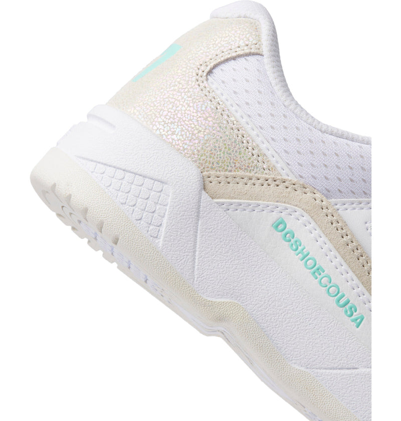 Close-up of DC Shoes Women's Construct Shoes, showcasing a leather upper, textured sole, iridescent heel detail, perforated panels, and teal DCSHOECOUSA branding on the side.