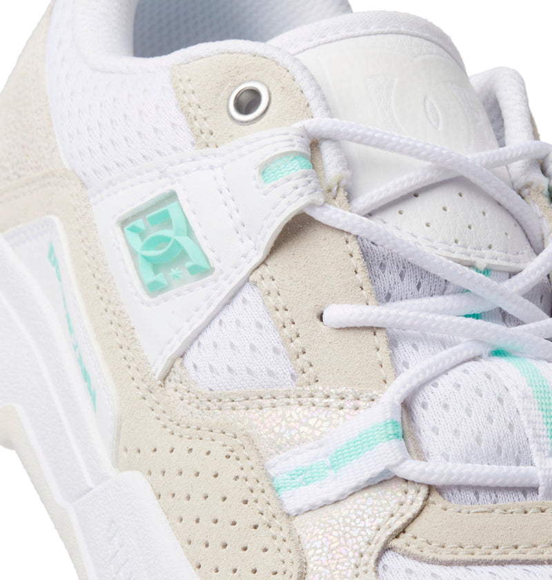Close-up of DC Shoes Women's Construct Shoes featuring a mesh, suede, and leather upper with mint green accents, white laces, and a small DC Shoes logo near the eyelets.