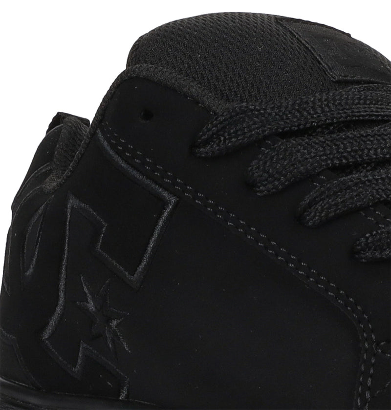 Close-up of the upper part of DC Shoes Women's Court Graffik Platform Shoes, featuring textured laces, detailed stitching, an embossed star logo on the side, and a matte finish that highlights this stylish women's footwear.