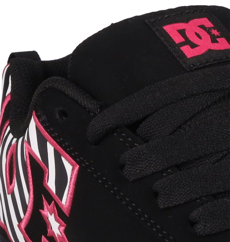 Close-up of the Women's Court Graffik Shoes by DC Shoes: black sneaker with black laces, a pink and white DC logo with a pink star, puffy silhouette, and black-and-white stripes near the side logo.