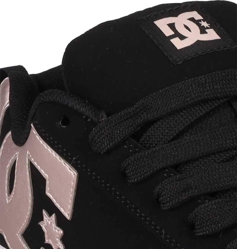 Close-up of DC Shoes Women's Court Graffik sneaker in black with black laces, a puffy silhouette, and a white DC logo on the side and tongue.