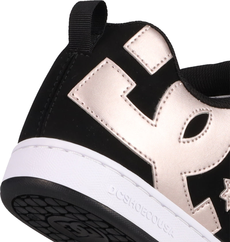 Close-up of the heel on Women's Court Graffik Shoes by DC Shoes, featuring a black puffy silhouette, metallic gold E design, white midsole embossed with DCSHOECOUSA, black pull tab and outsole. The iconic DC logo completes the bold look.