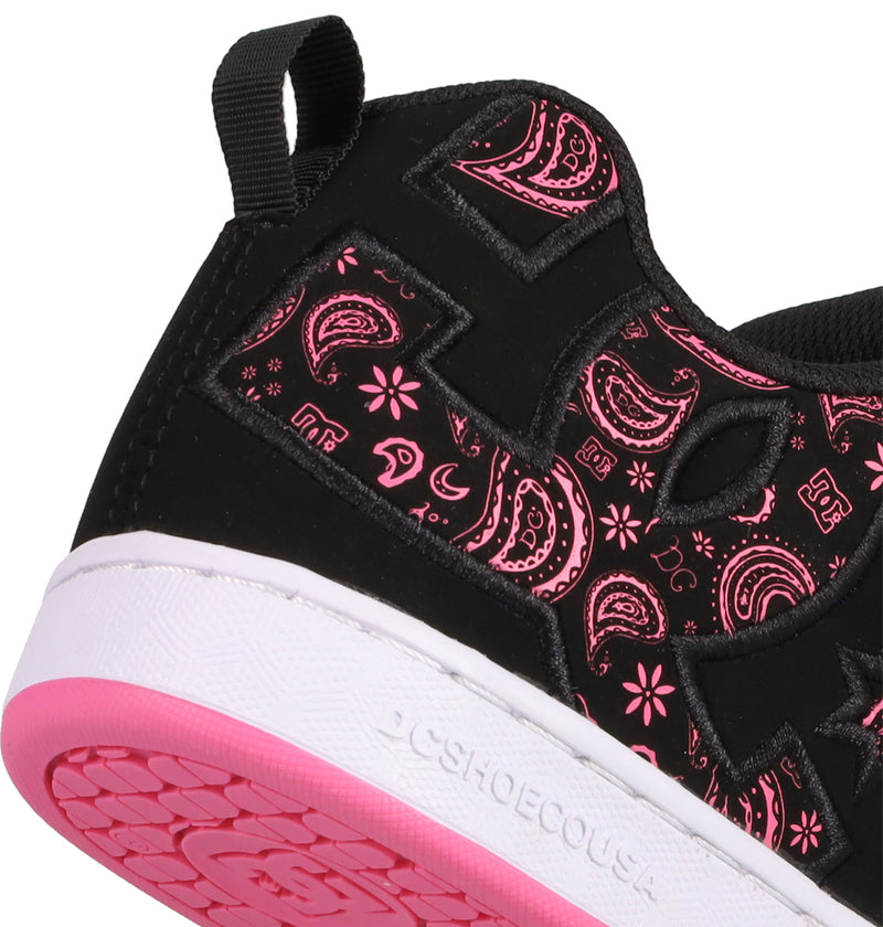 Close-up of the Women's Court Graffik Shoes by DC Shoes in black, showcasing pink paisley and floral patterns, a white midsole, pink outsole, puffy silhouette, black heel pull tab, and DC SHOES embossed on the sole.