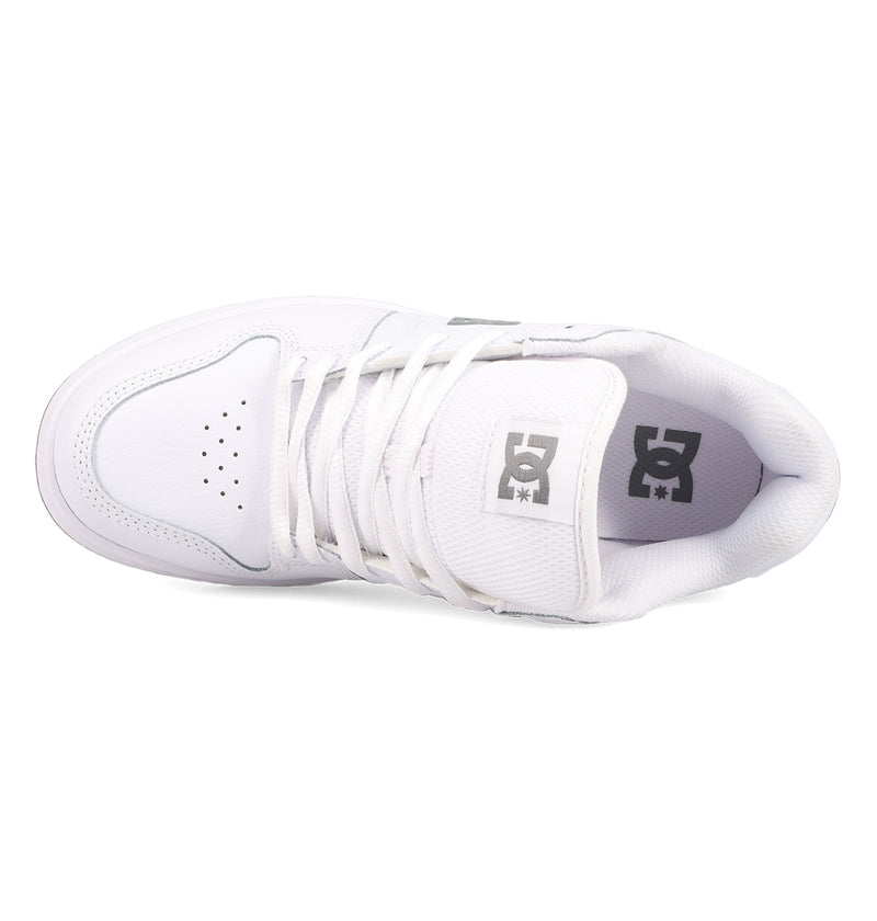 Top view of a white Women's Manteca 4 Shoe by DC Shoes, featuring white laces, toe perforations, and a gray logo on the tongue—offering a clean, minimal look with performance-focused design.