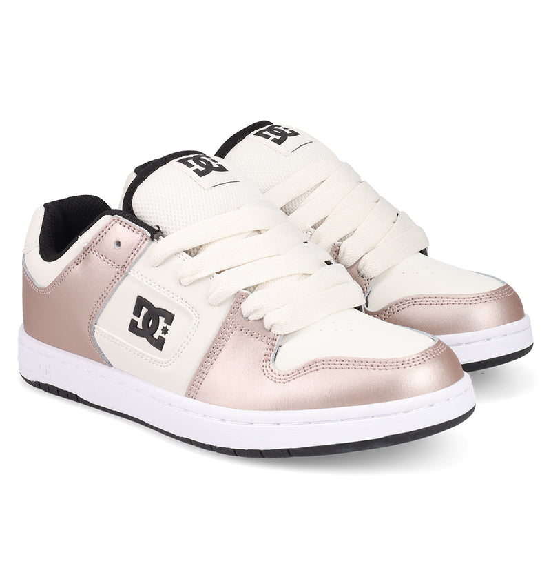 The Women's Manteca 4 Shoes by DC Shoes feature white laces, cream panels, metallic rose gold accents, black lining, and bold DC logos—stylish and comfortable sneakers for women.