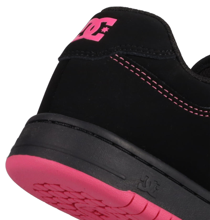 Close-up of the heel of the DC Shoes Women's Manteca 4, featuring black material with pink stitching, a pink DC logo on the heel, and a pink sole.