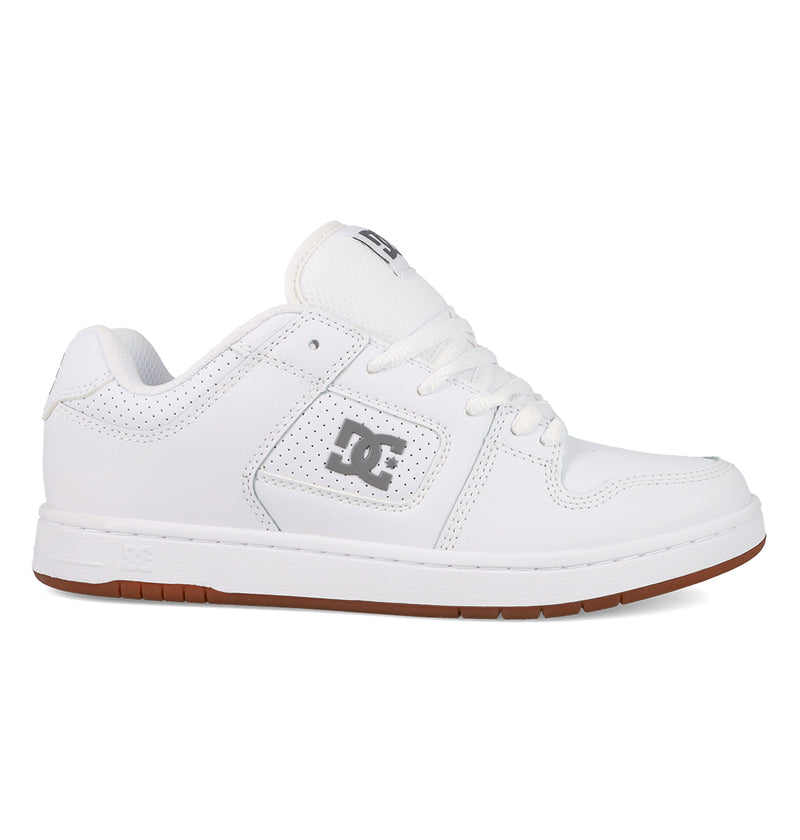 The Women's Manteca 4 Shoes by DC Shoes feature a low-top, performance design with white laces, a gray DC logo, and a brown rubber sole, displayed in side profile on a plain white background.